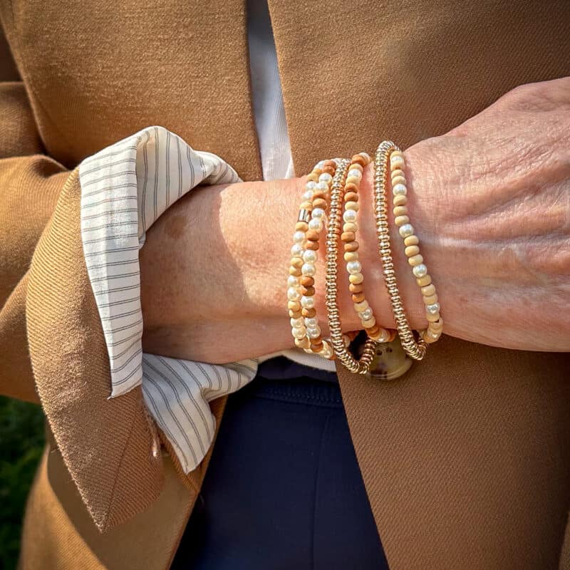 Detail: Susan B. wears Roxanne Assoulin stretch bracelets in "affogato."