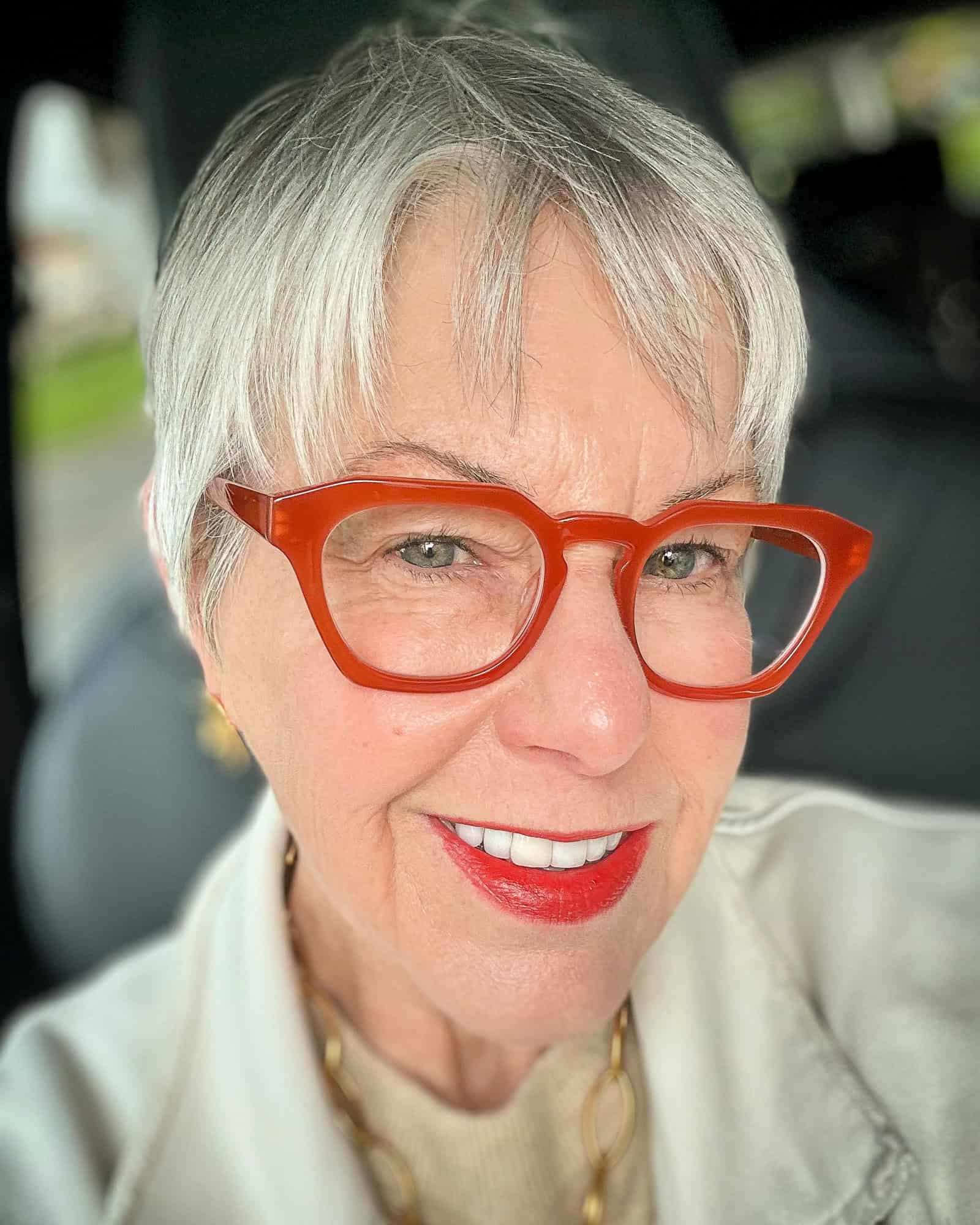 Susan B. wears Warby Paker "Rufus" eyewear and Jane Iredale ColorLuxe lipstick in "Poppy."