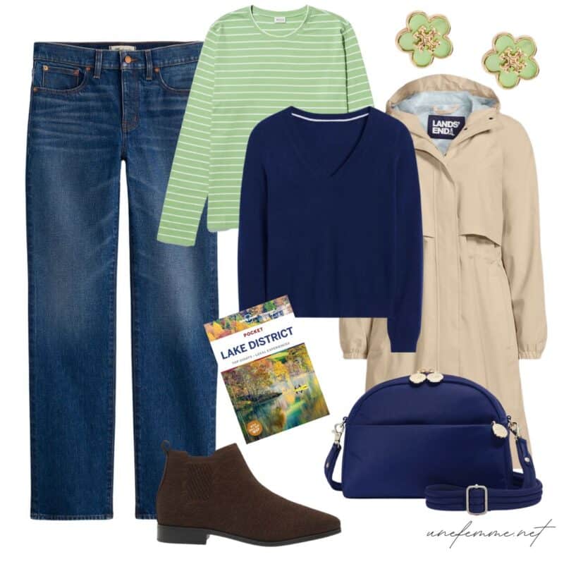 Travel outfit idea with jeans, green striped top, navy v-neck sweater, tan raincoat, brown suede booties.