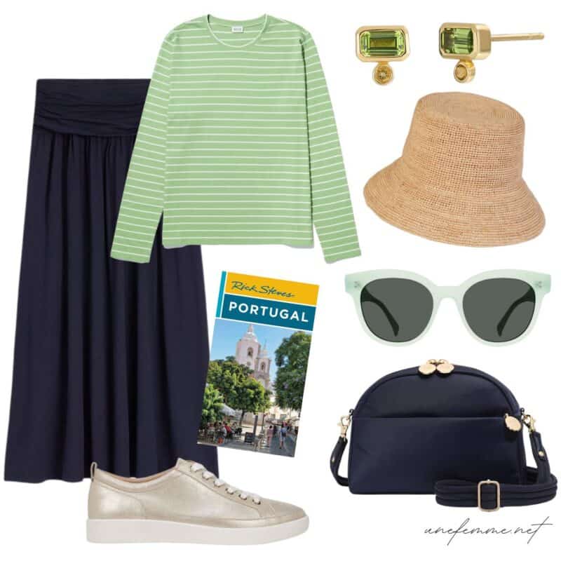 Travel outfit idea with a navy jersey skirt, striped top, metallic sneakers.