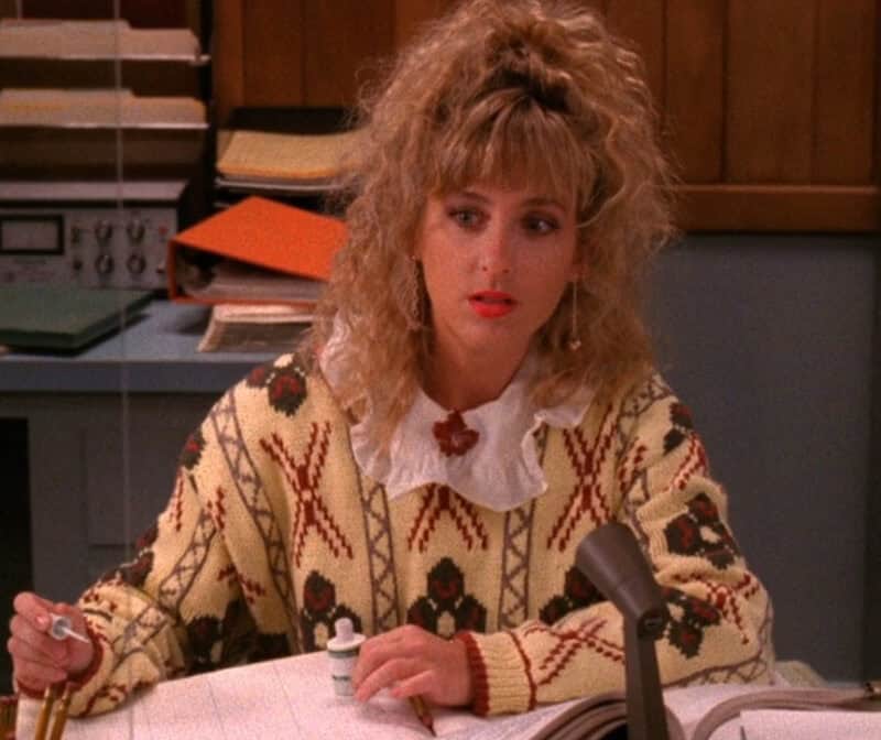 "Lucy" from Twin Peaks with a ruffled collarand patterned sweater.