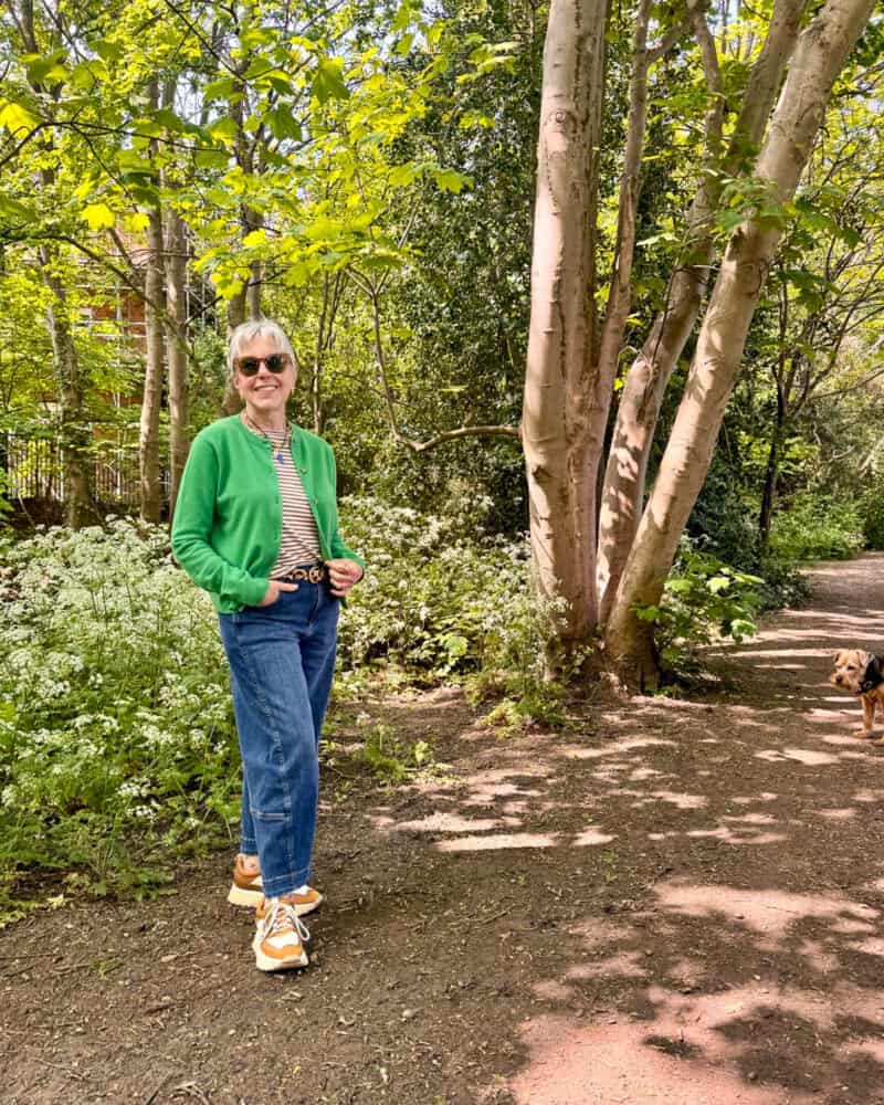 Susan B. walks in the woods near Putney.