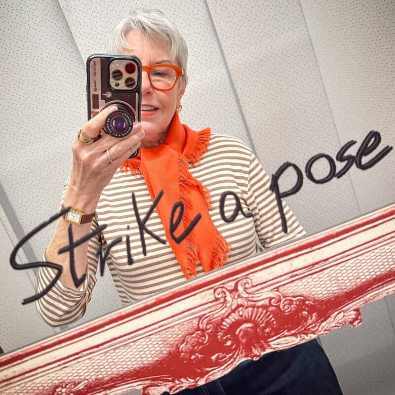 Susan takes a mirror selfie in the hotel elevator.