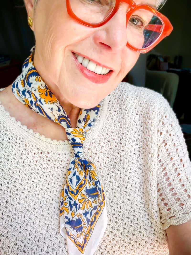 Susan B. wears a blue and yellow print cotton bandana with a crochet-effect top.