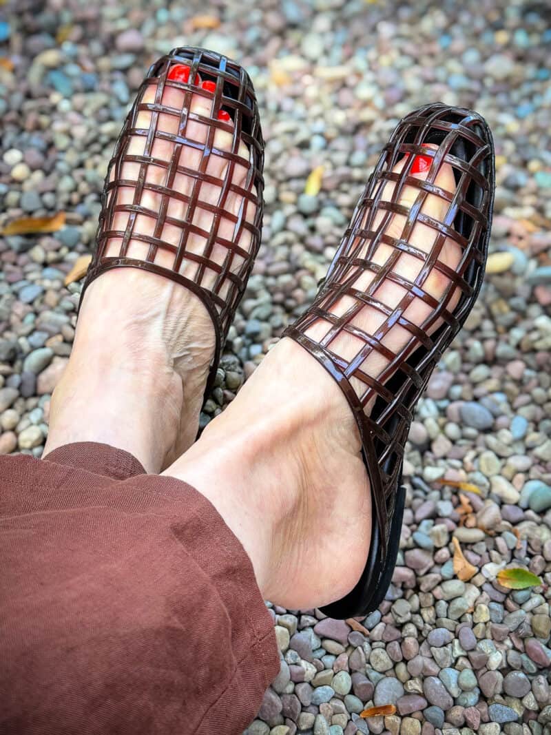 Detail: Susan B. wears Vince jelly cage sandals.
