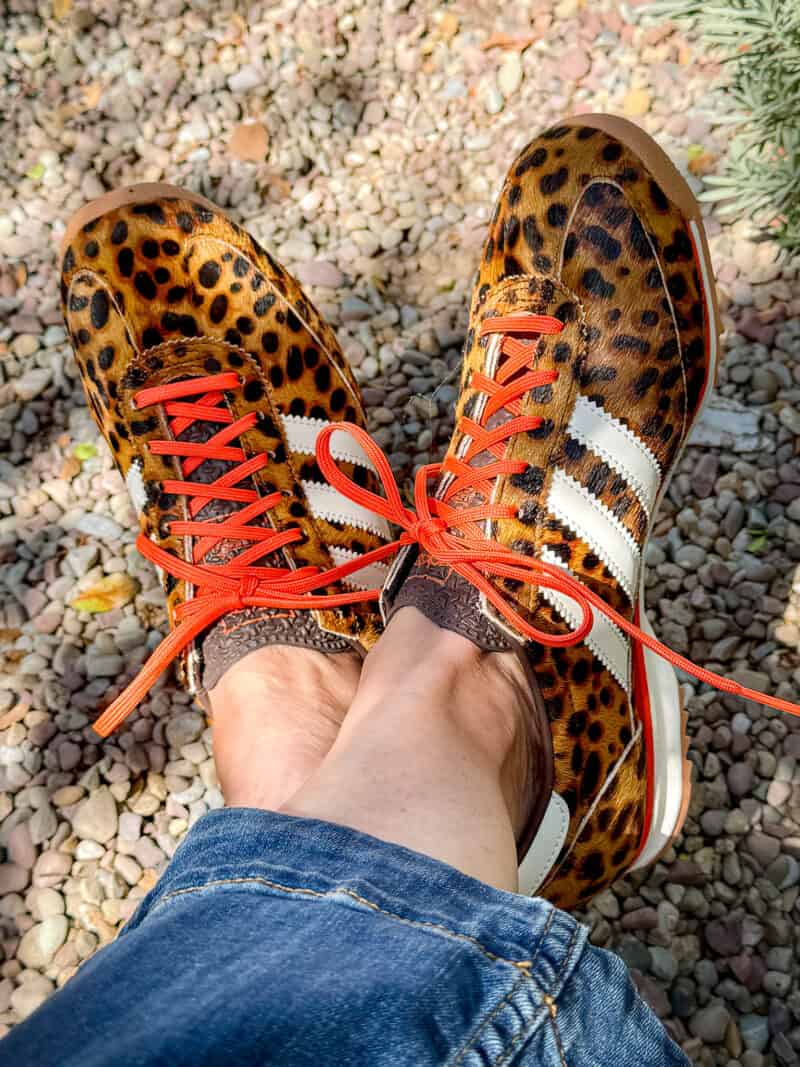 Detail: Susan B. wears adidas SL72 OG leopard print sneakers.