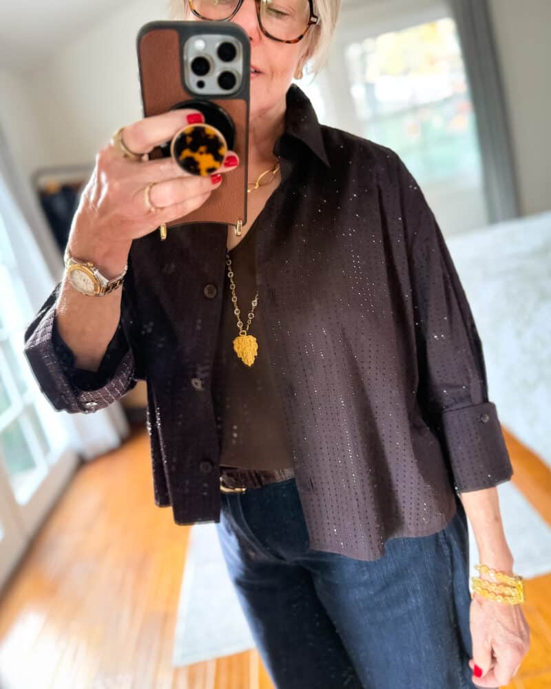 Detail: Susan B. wears a sparkly brown Madewell popline shirt, Austrian crystal and gold pendant necklade from French Kande.