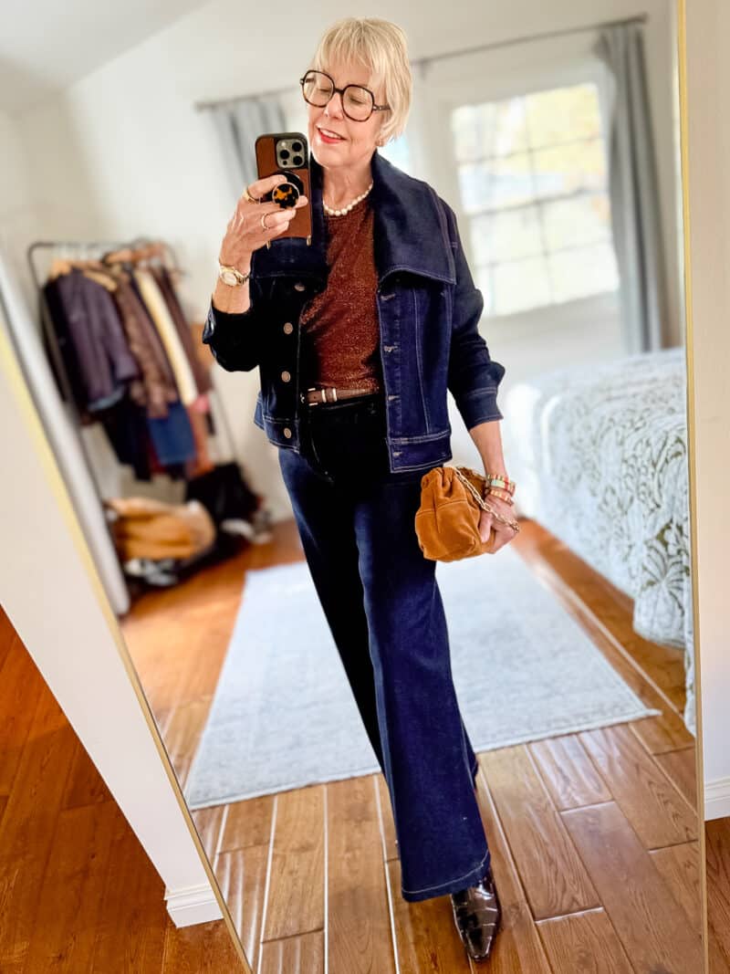 Susan B. wears an elevated denim look with a dark wash jacket and palazzo jeans from Ruti.