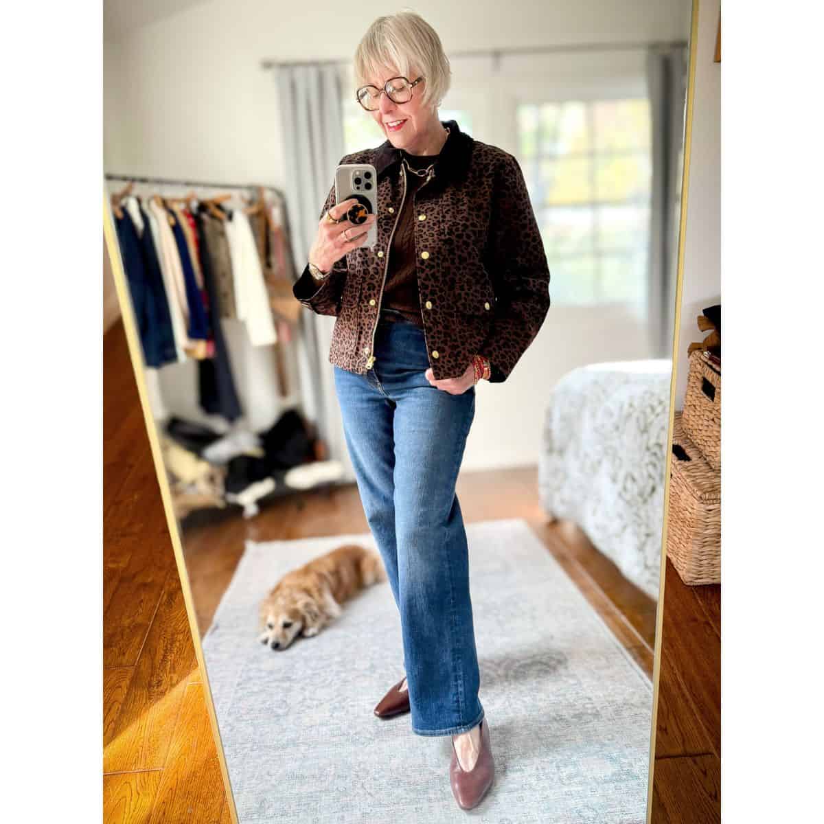Leopard print field jacket styled with straight-leg jeans, a neutral sweater tee, and casual shoes for an easy spring outfit