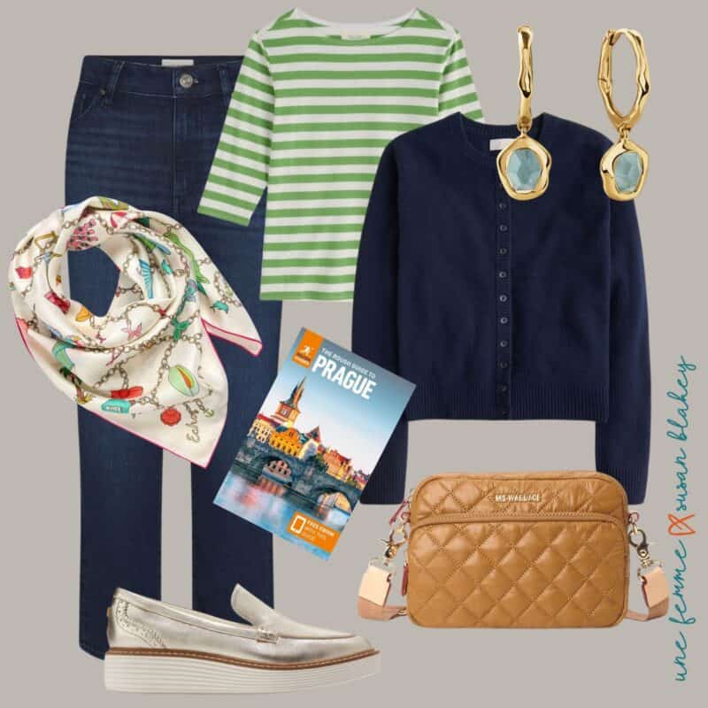 Spring travel outfit idea in a warm palette, with charm print silk scarf, straight leg jeans, striped tee, gold earrings, navy cashmere cardigan, metallic gold loafers, and camel quilted nylon camera bag.