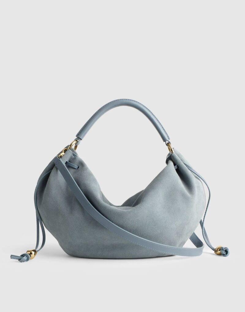 Madewell Carmen shoulder bag in light blue suede.