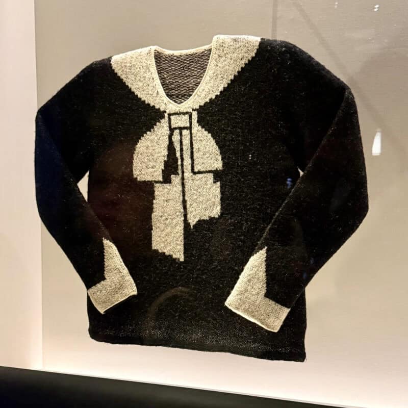 Schiaparelli knit sweater with trome l'oeil bow collar design.
