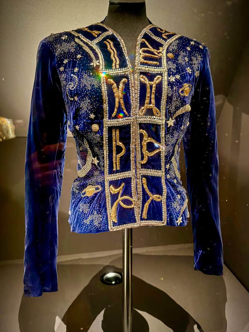 Sciaparelli blue velvet jacket embroidered with gold astrological designs.