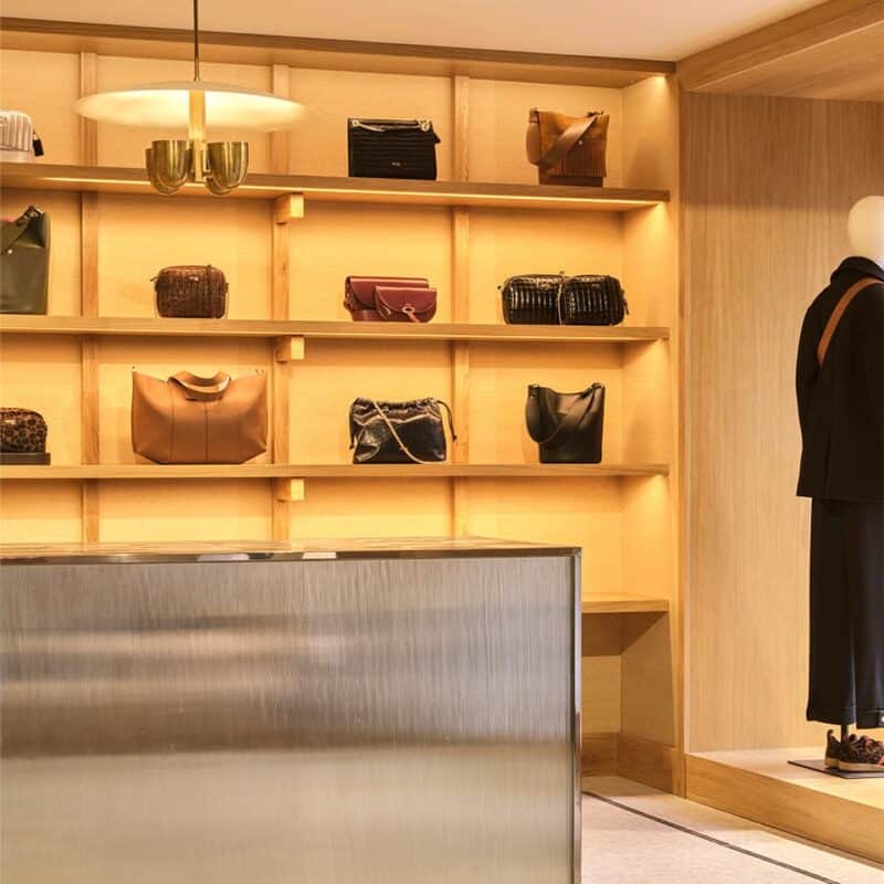 Handbags on shelves in Balzac store, Paris.