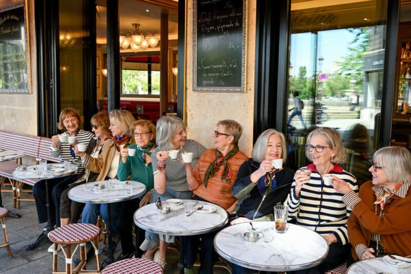 A toast to Paris! Paris Fashion Tour group enjoys a coffee break at a traditional cafe.