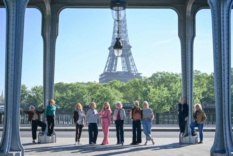Paris Fashion Tour with Susan Blakey group photo on bridge with Eiffel Tower in background.