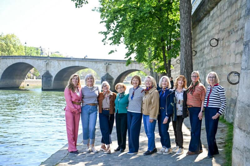 Paris Fashion Tour group poses for photos along the Seine on Ile St. Louis.