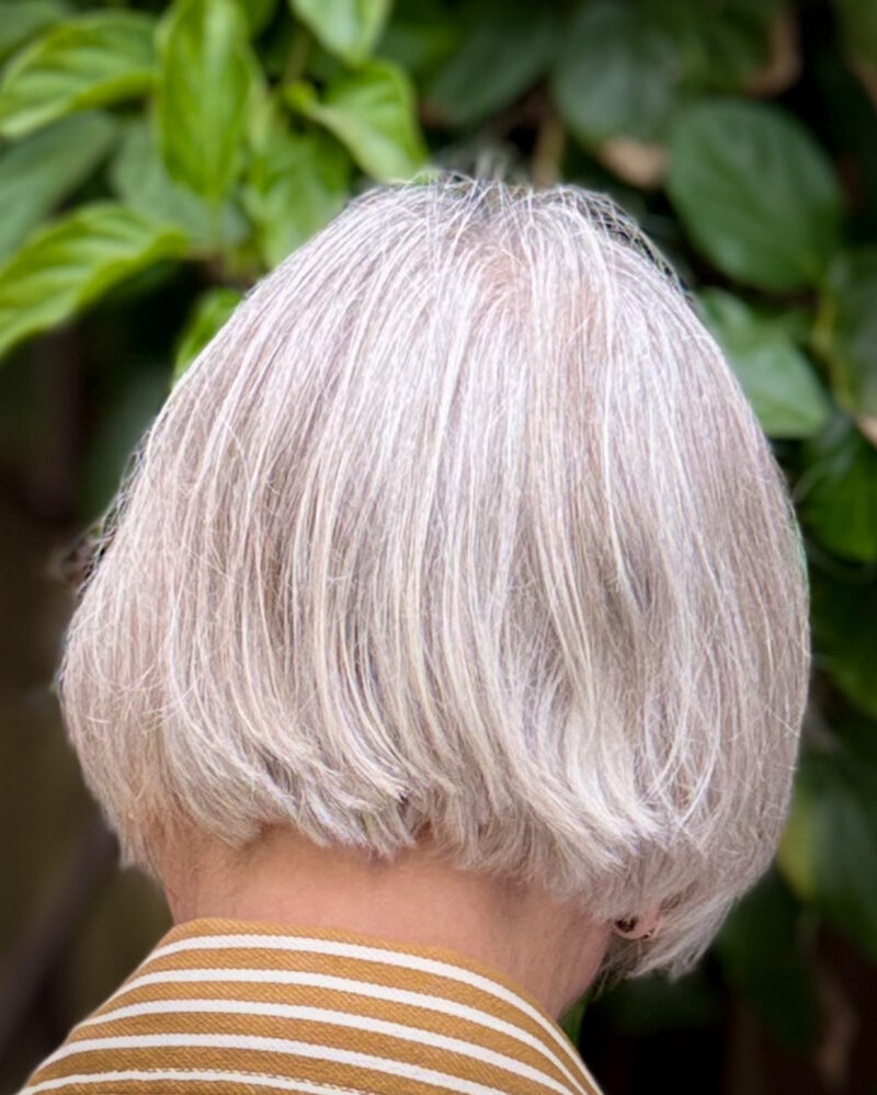 Silver grey French bob haircut back view — a chic, low-maintenance style for women with grey hair