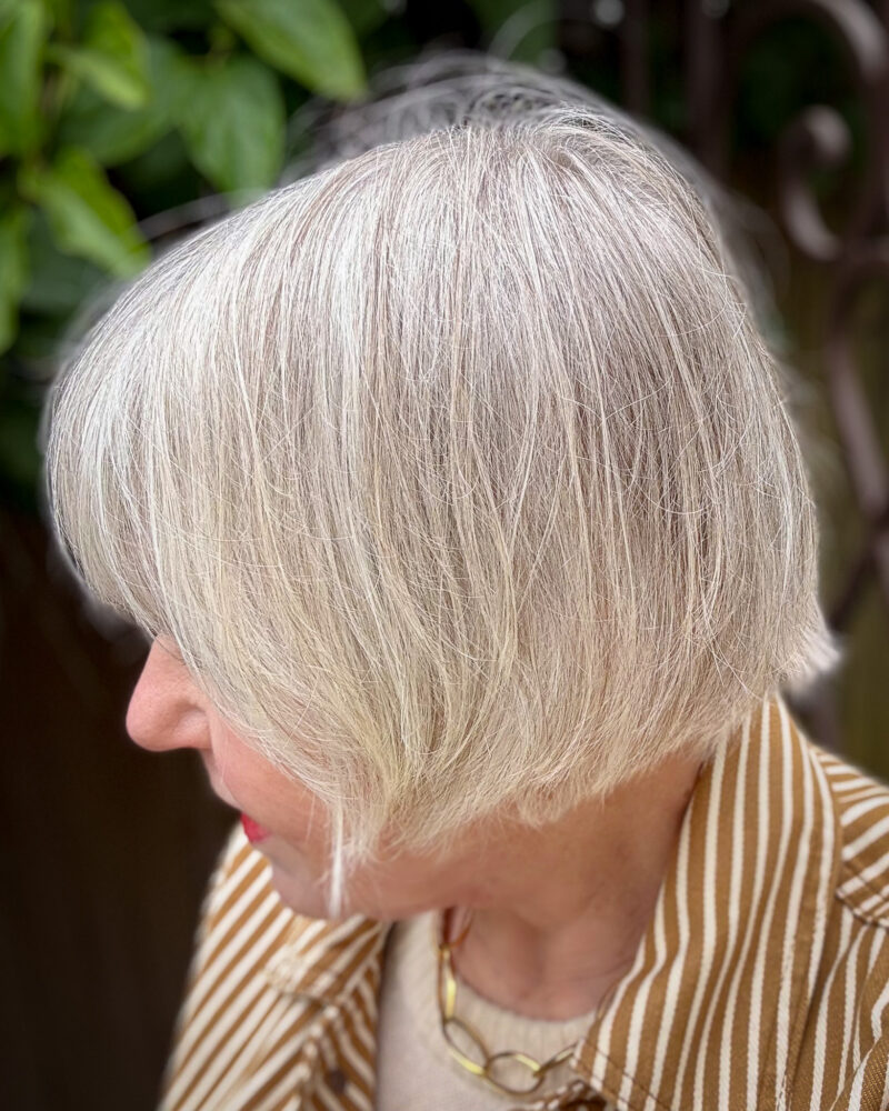 Silver grey French bob haircut side view — a chic, low-maintenance style for women with grey hair