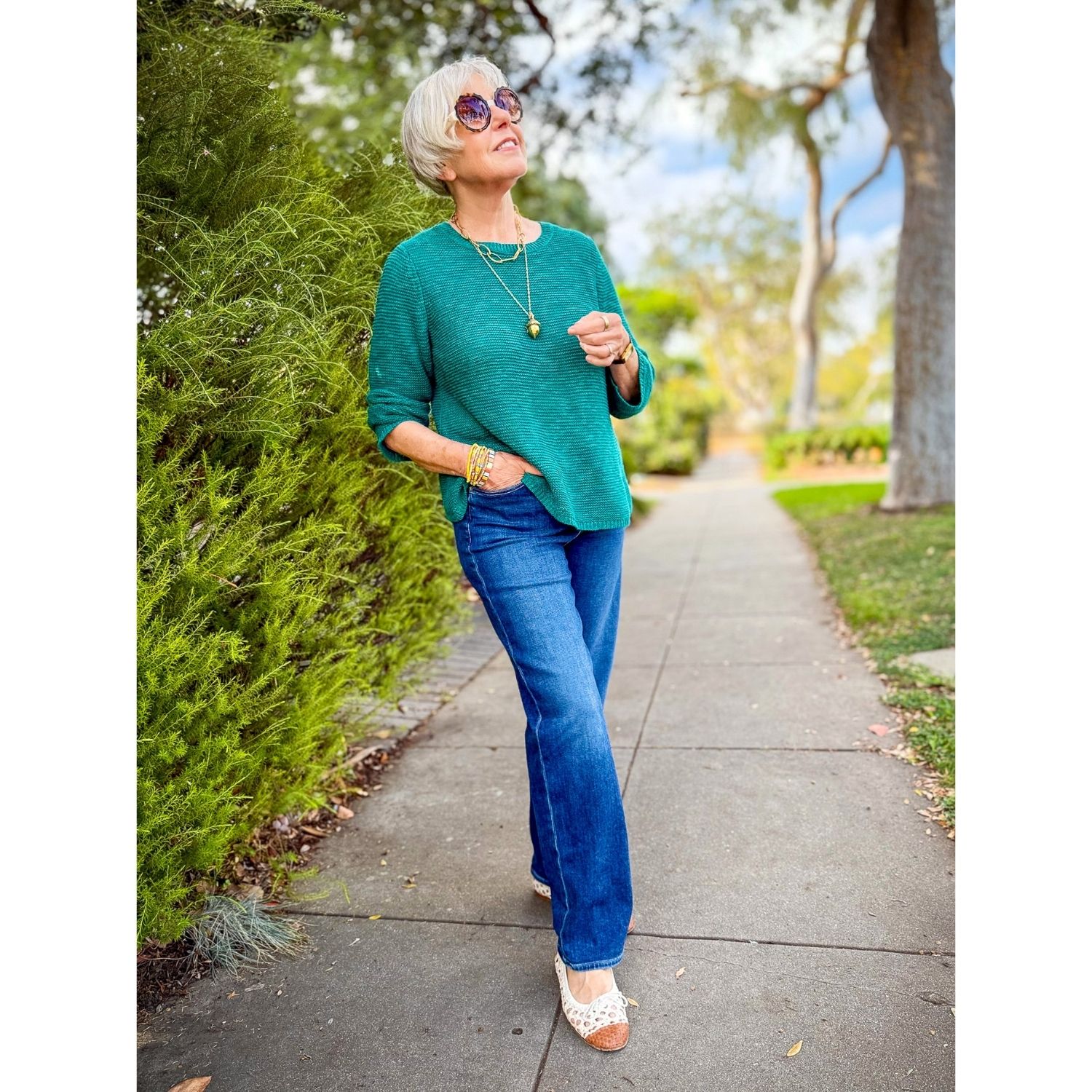 Teal Eileen Fisher linen-cotton sweater styled with jeans for fall.