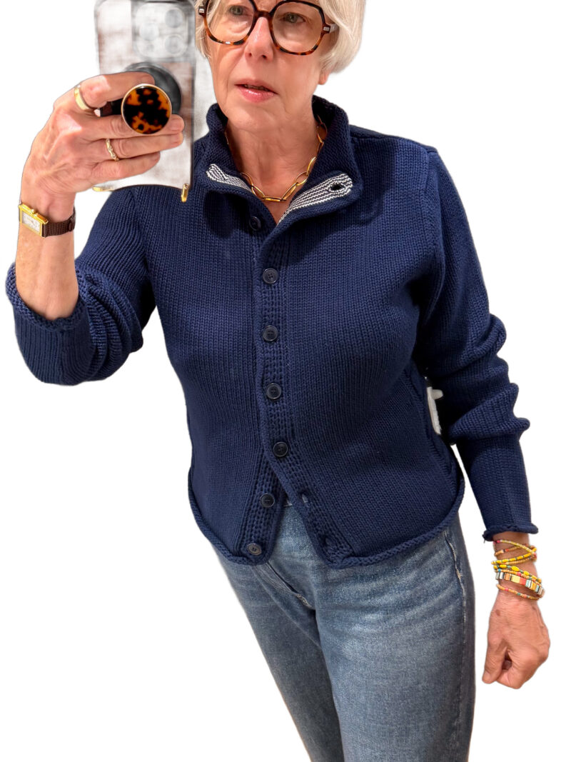 Susan B. wears the J.Crew Rollneck cotton cardigan in Navy.