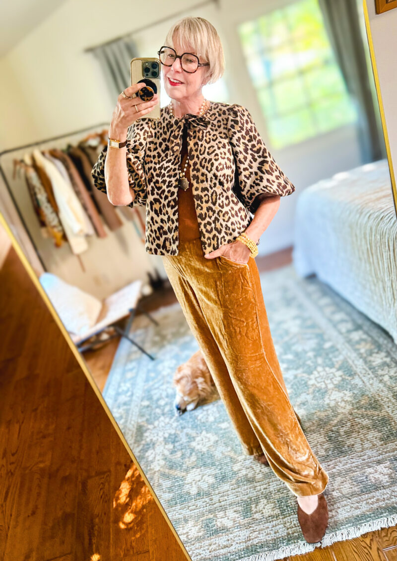 Susan pairs gold velvet pants with a leopard-print jacket, brown top, and brown suede shoes.